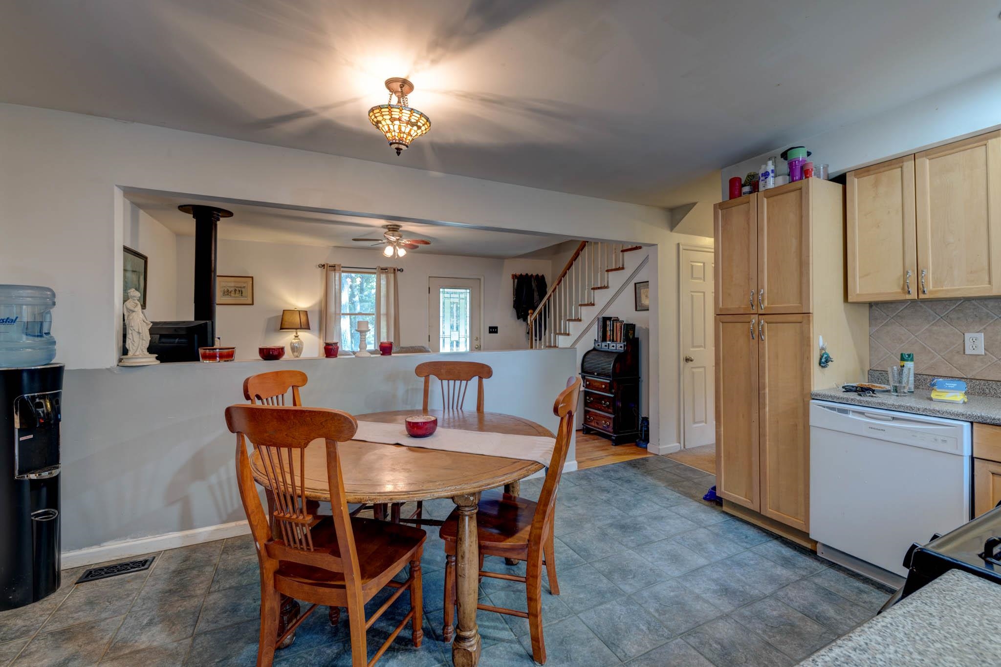 106 Delair Road Cape May, NJ 08204 - Photo 9 of 28 a view of a dining room with furniture and a kitchen