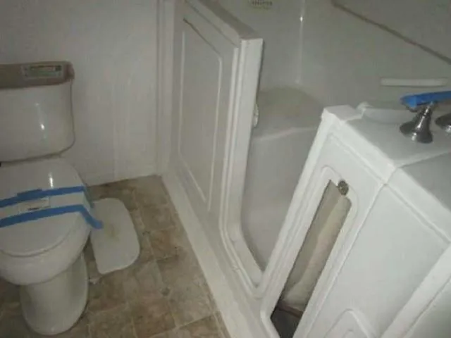a bathroom with a toilet and a sink