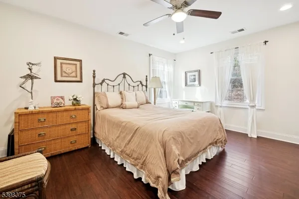 a spacious bedroom with a bed and a window