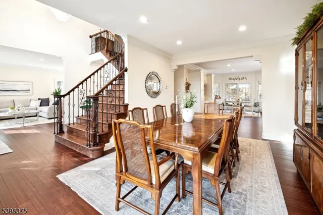 a dining room with furniture and wooden floor