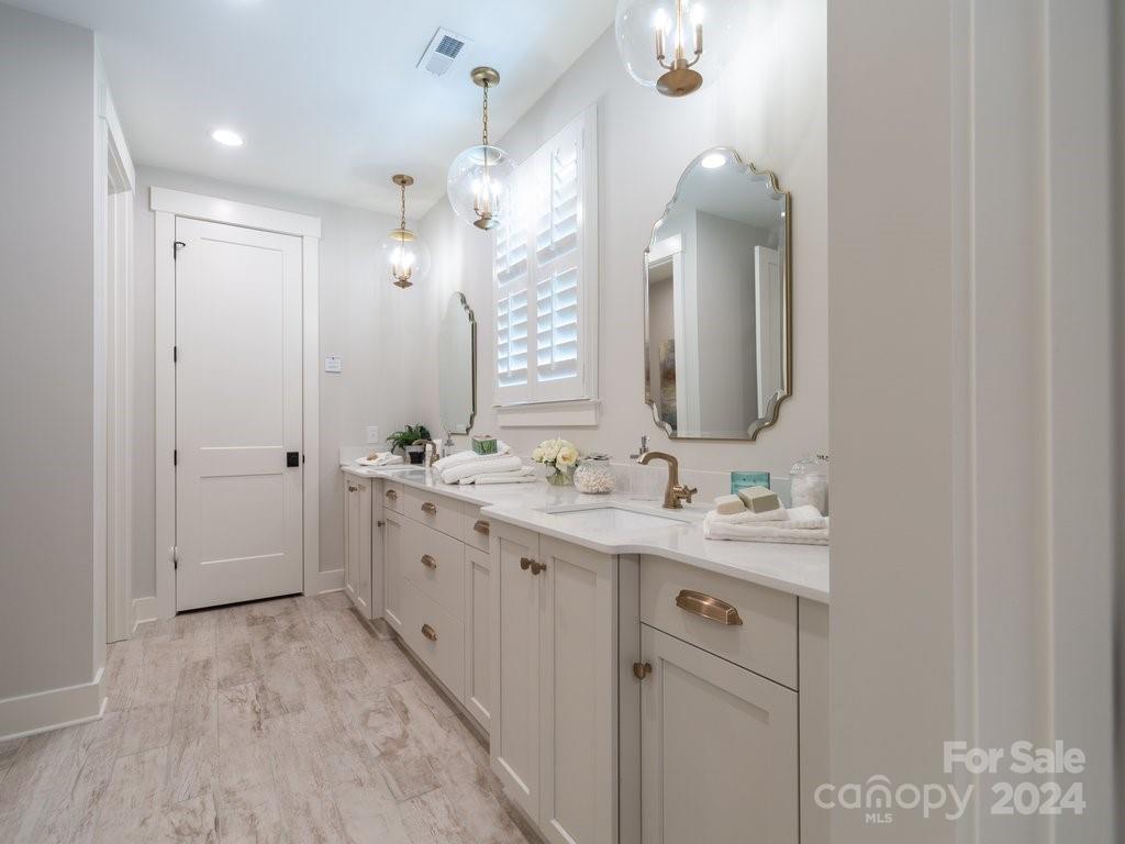 4298 Persimmon Road Lancaster, SC 29720 - Photo 15 of 46 a spacious bathroom with a double vanity sink mirror and double
