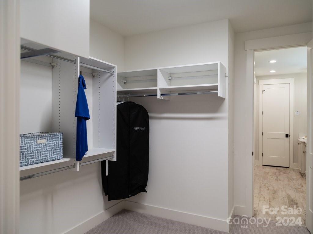 4298 Persimmon Road Lancaster, SC 29720 - Photo 21 of 46 a view of walk in closet with clothes and shoes