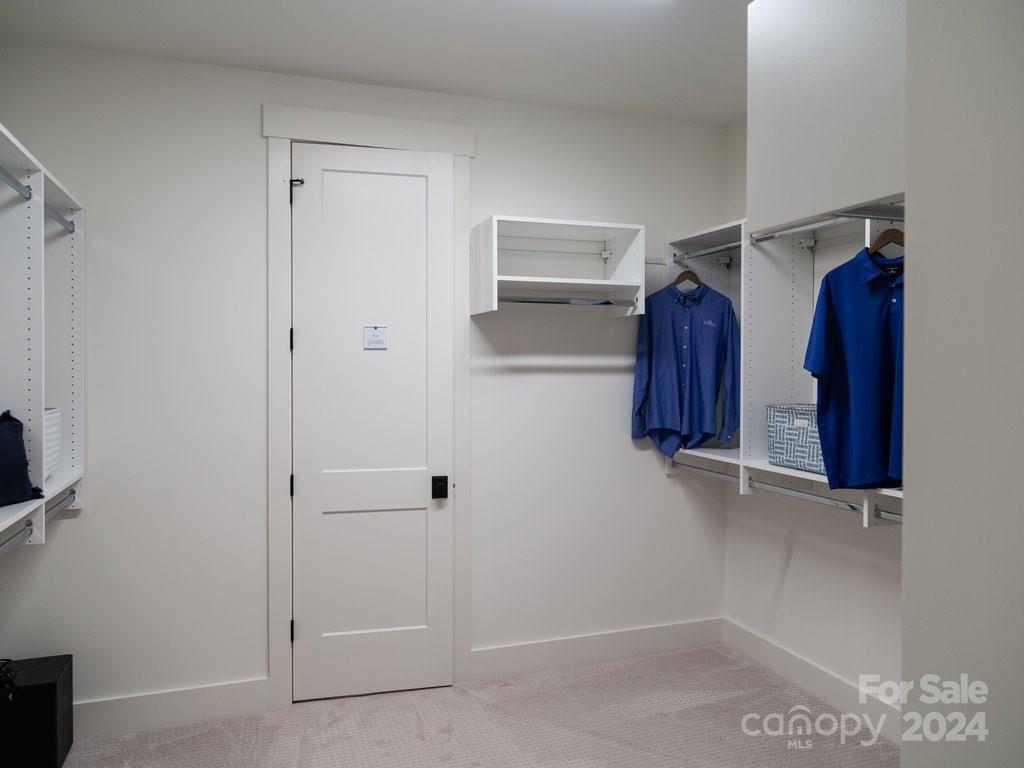 4298 Persimmon Road Lancaster, SC 29720 - Photo 22 of 46 a view of walk in closet with clothes