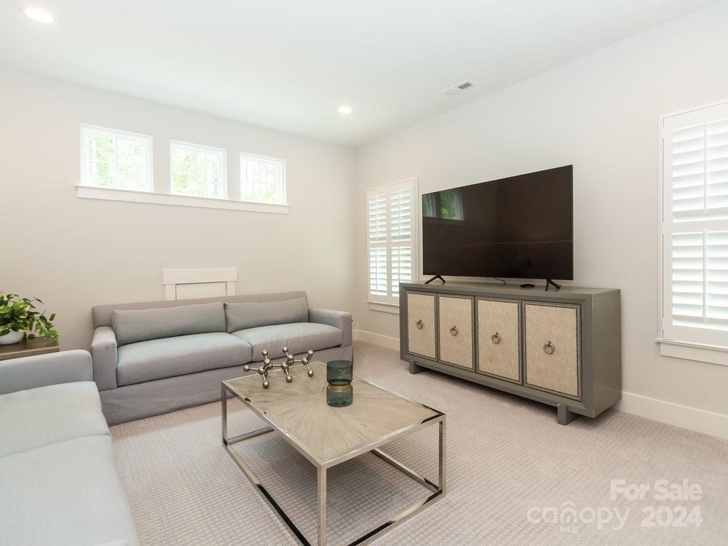 4298 Persimmon Road Lancaster, SC 29720 - Photo 30 of 46 a living room with furniture and a flat screen tv