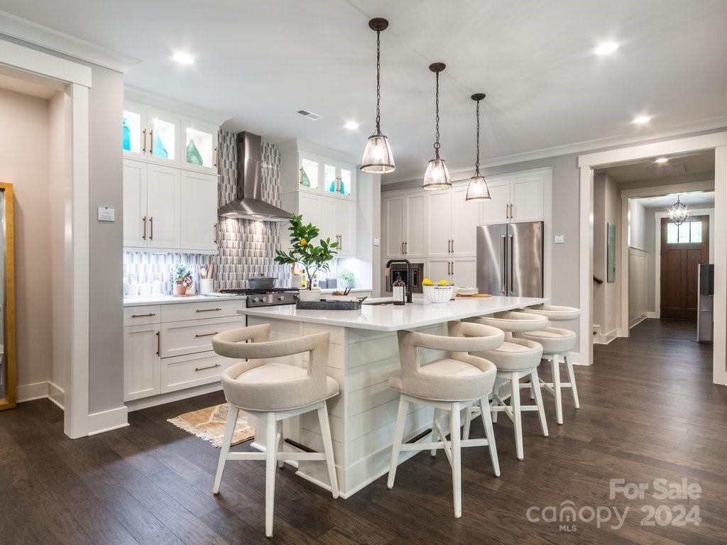 4298 Persimmon Road Lancaster, SC 29720 - Photo 3 of 46 a kitchen with stainless steel appliances kitchen island granite countertop a dining table chairs and sink