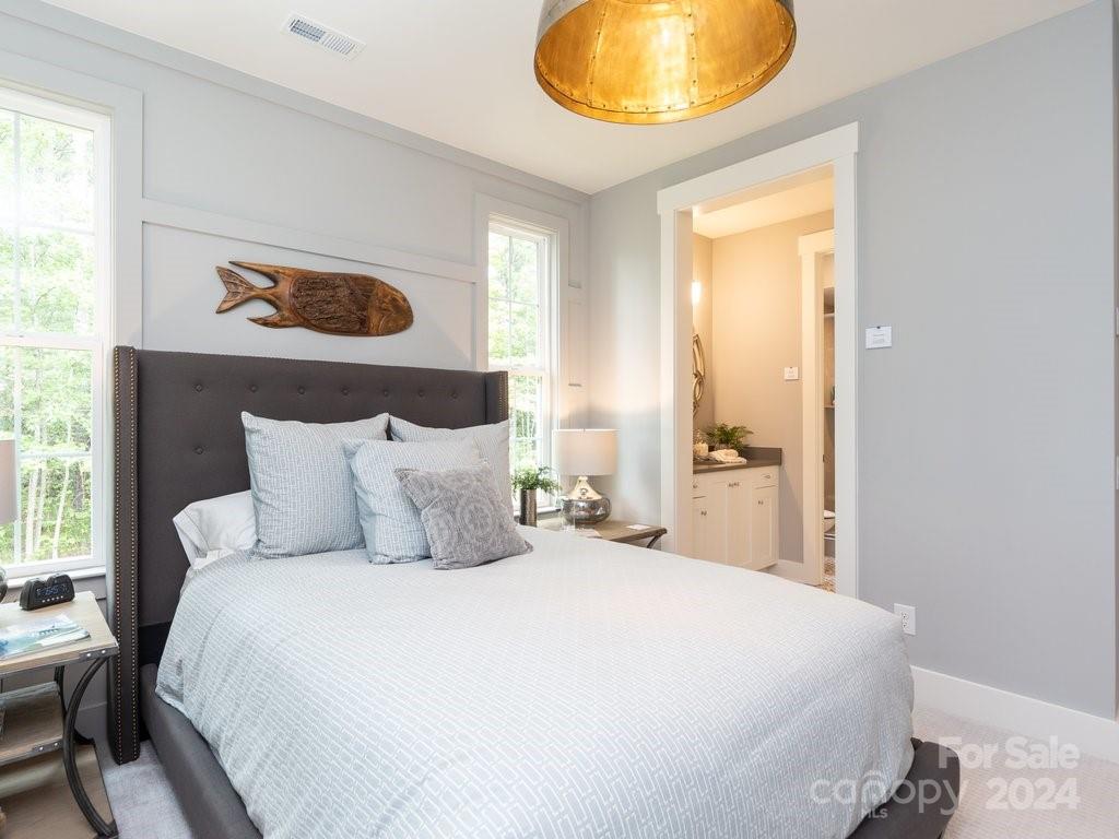 4298 Persimmon Road Lancaster, SC 29720 - Photo 33 of 46 a bedroom with a bed and a painting on the wall