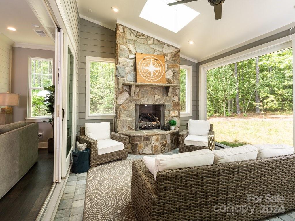 4298 Persimmon Road Lancaster, SC 29720 - Photo 41 of 46 a living room with furniture large window and a fireplace