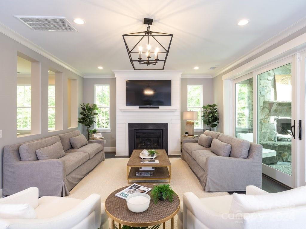 4298 Persimmon Road Lancaster, SC 29720 - Photo 6 of 46 a living room with furniture a fireplace and a large window