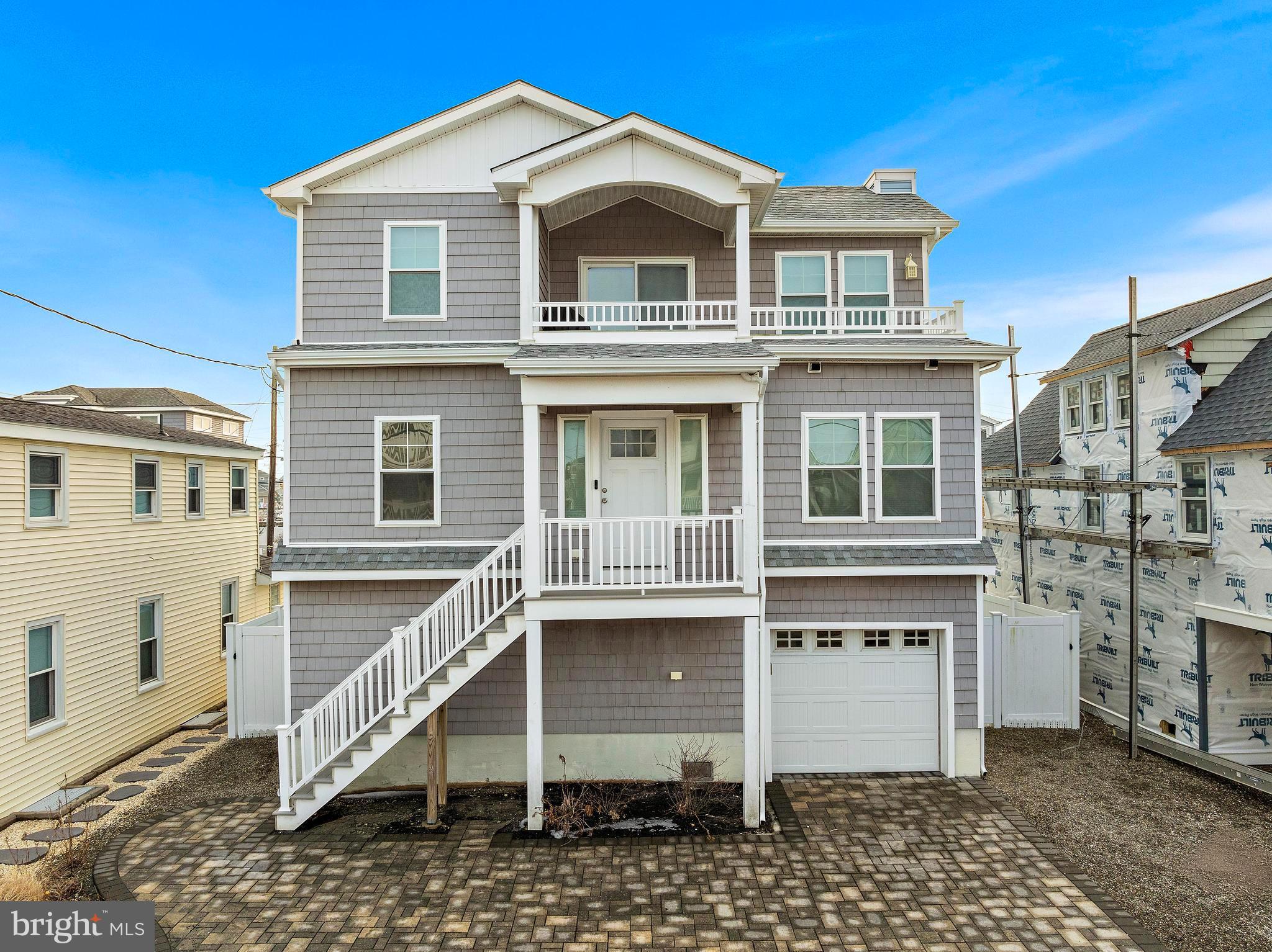 106 West 26th Street Ship Bottom, NJ 08008 - Photo 1 of 15 a front view of a house with a yard