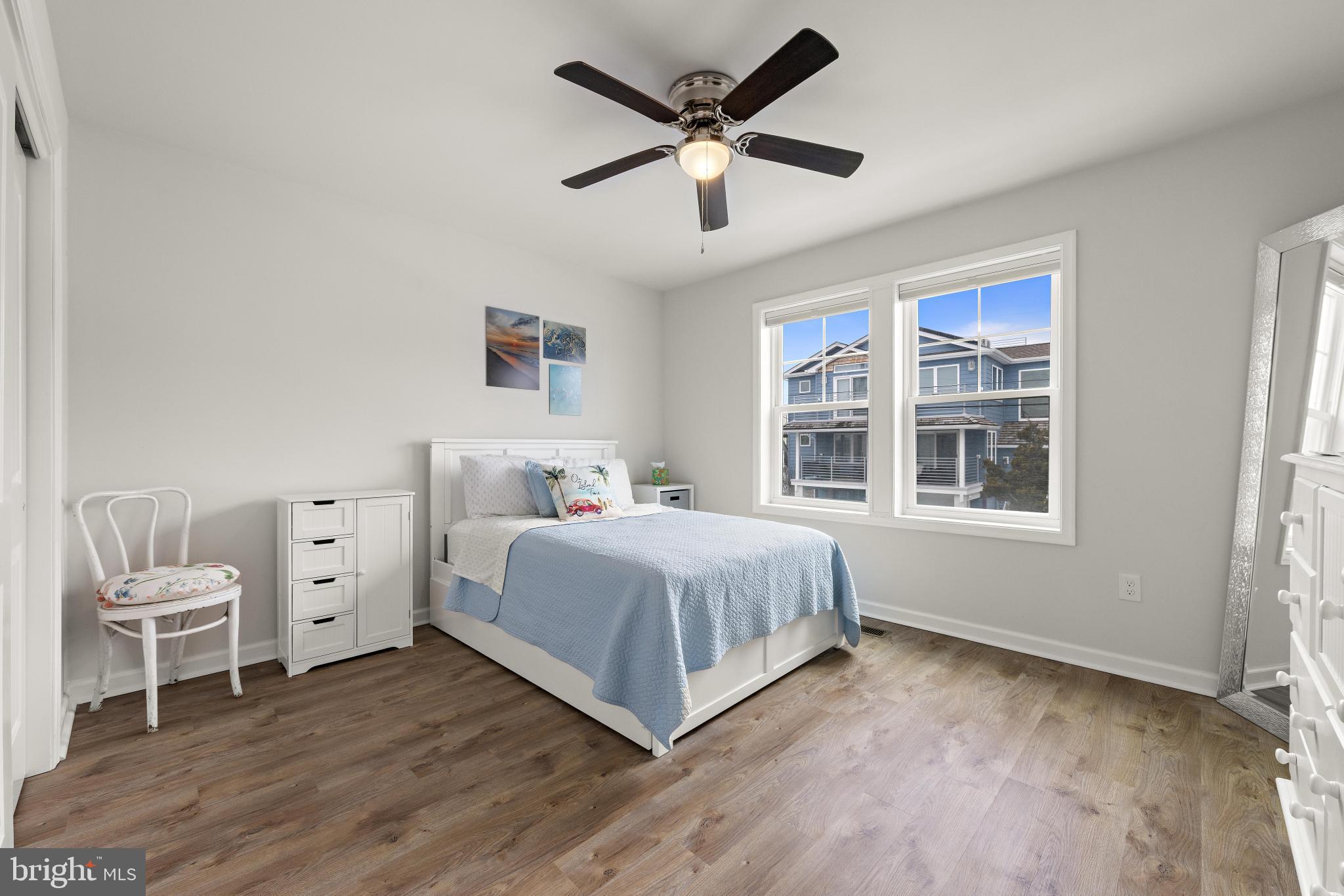106 West 26th Street Ship Bottom, NJ 08008 - Photo 13 of 15 a spacious bedroom with a large bed and a window