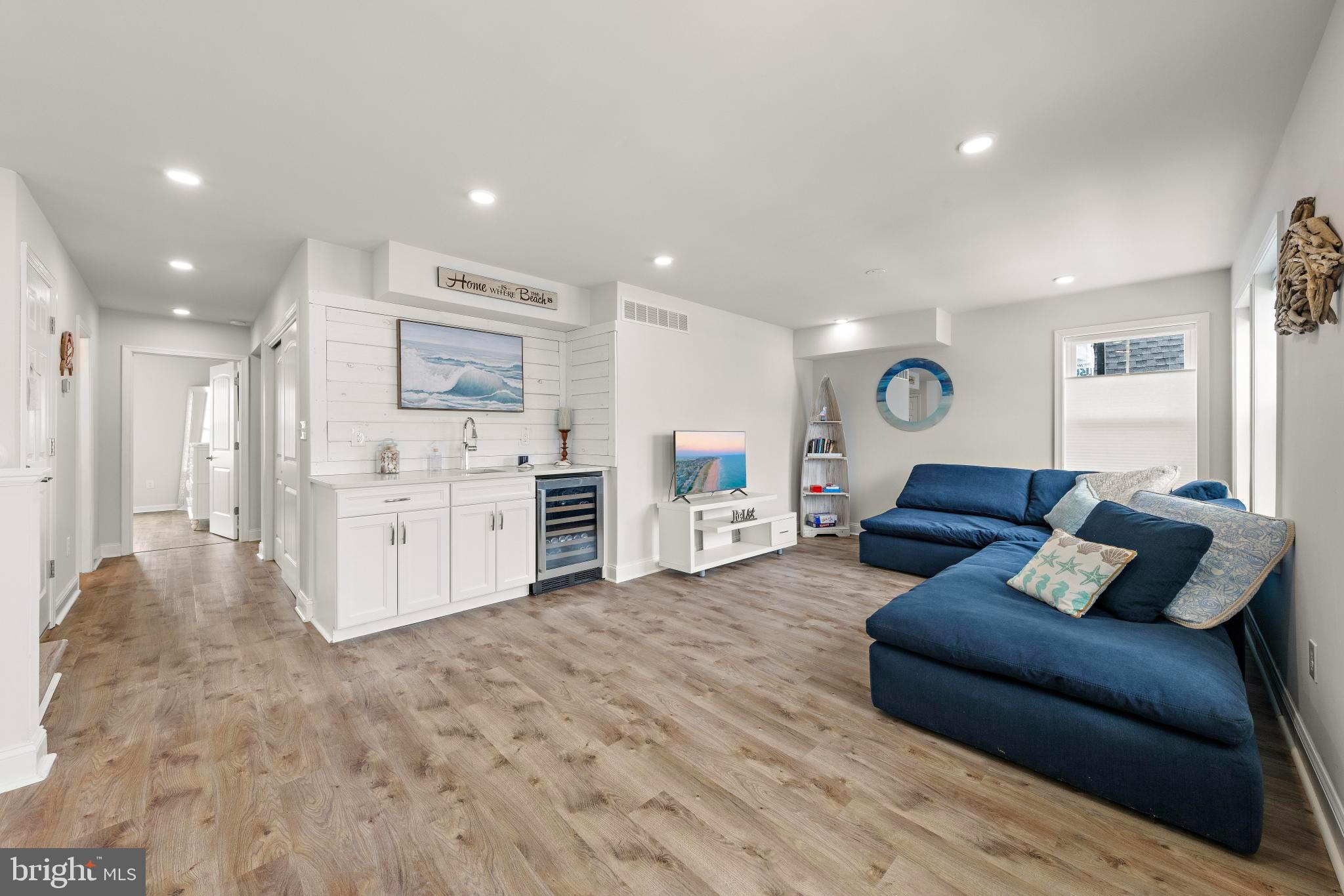 106 West 26th Street Ship Bottom, NJ 08008 - Photo 4 of 15 a living room with furniture and kitchen view