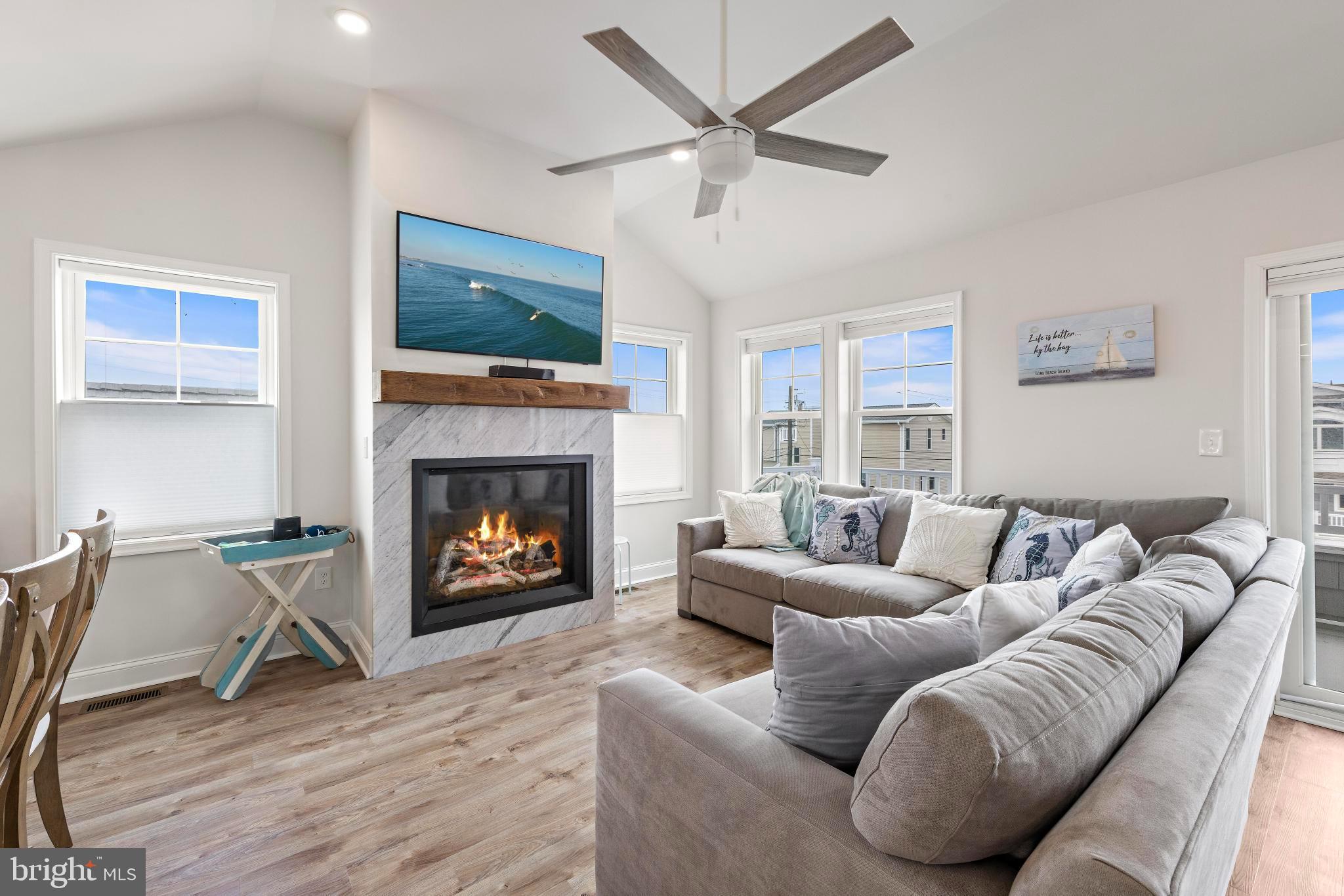 106 West 26th Street Ship Bottom, NJ 08008 - Photo 7 of 15 a living room with furniture and a fireplace