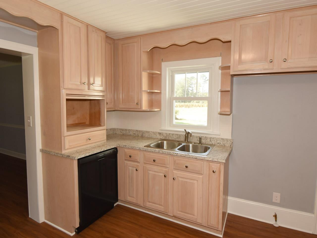 1525 Micro Road Selma, NC 27576 - Photo 8 of 25 Lots of counterspace and cabinets in roomy kitchen. Kitchen