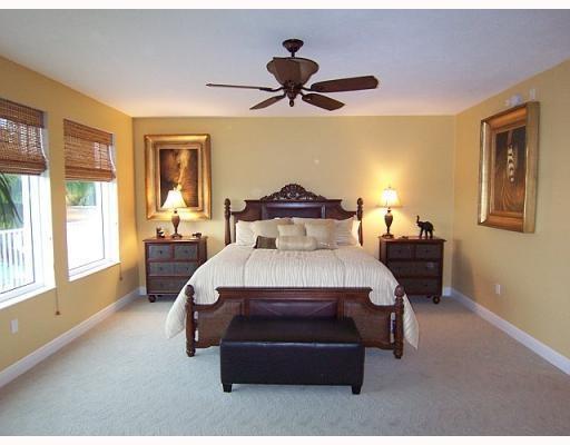 700 Highway 1, Unit 103 Jupiter, FL 33477 - Photo 15 of 36 a spacious bedroom with a bed and a window
