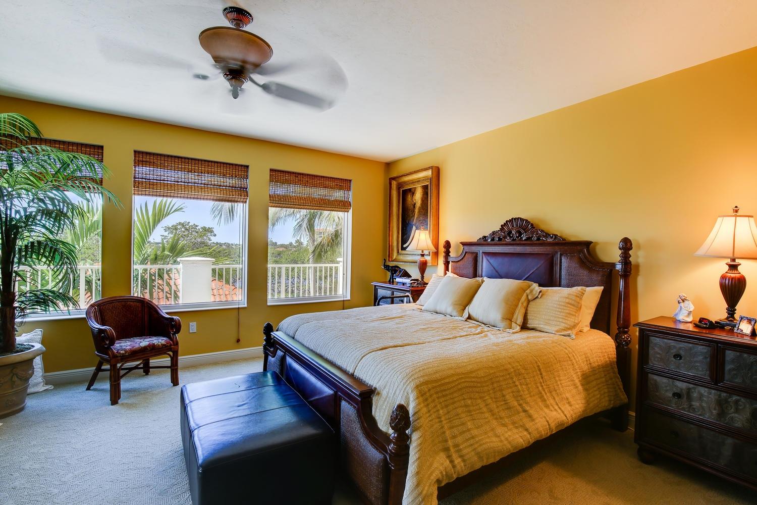 700 Highway 1, Unit 103 Jupiter, FL 33477 - Photo 16 of 36 a bedroom with a bed and a couch