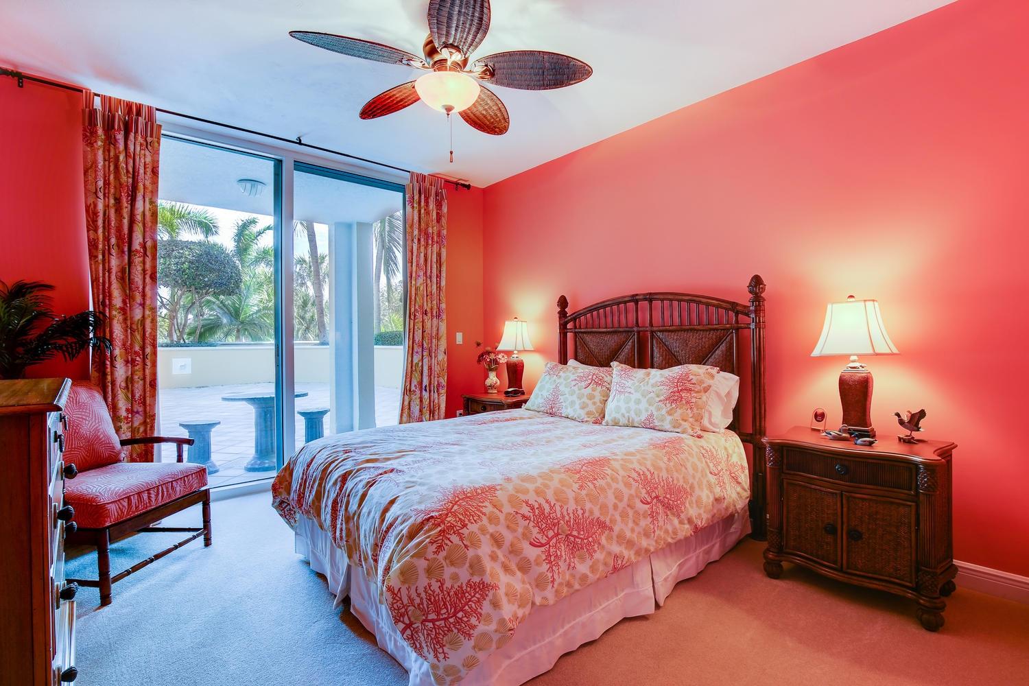 700 Highway 1, Unit 103 Jupiter, FL 33477 - Photo 18 of 36 a bedroom with a bed and lamp