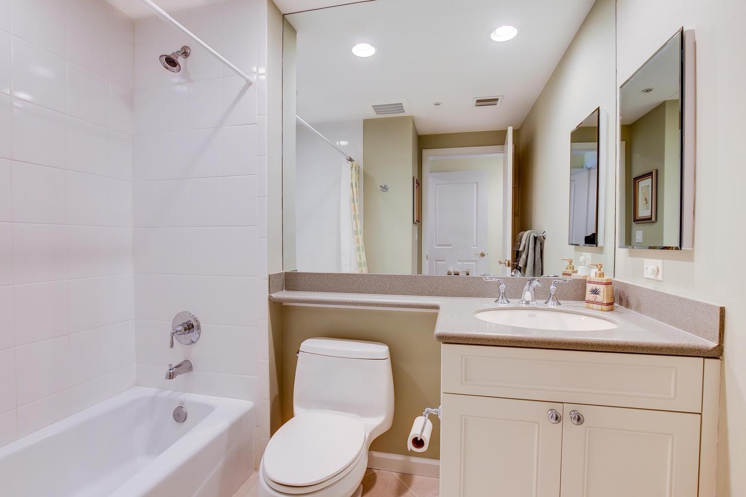 700 Highway 1, Unit 103 Jupiter, FL 33477 - Photo 21 of 36 a bathroom with a sink a toilet and a bathtub