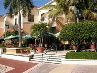 700 Highway 1, Unit 103 Jupiter, FL 33477 - Photo 35 of 36 a view of a building with a palm tree