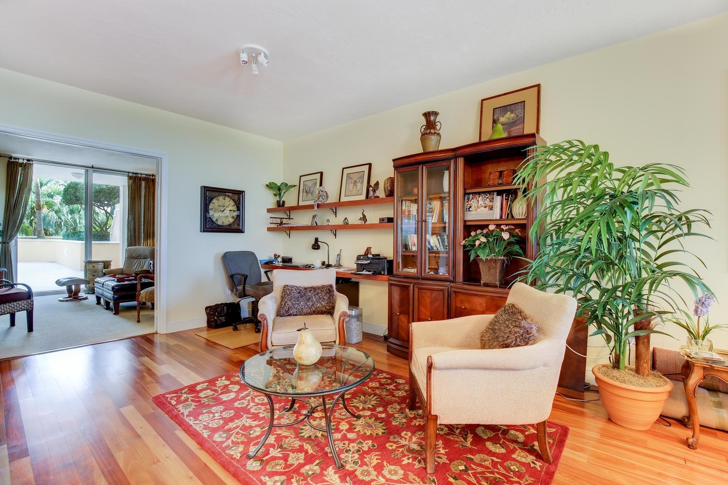 700 Highway 1, Unit 103 Jupiter, FL 33477 - Photo 9 of 36 a living room with furniture and a potted plant