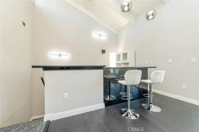 a view of a dining room with furniture and window