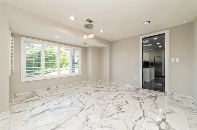 wooden floor in an empty room with a fireplace