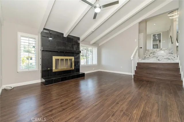 a bedroom with a bed and a large mirror
