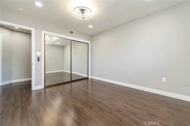 a bedroom with a bed and a table