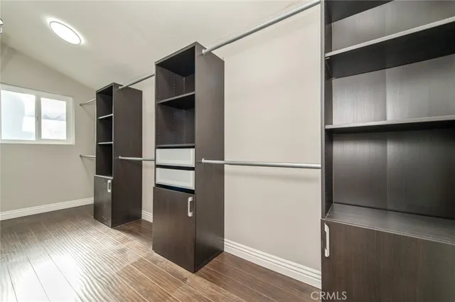 a view of a room with furniture and window