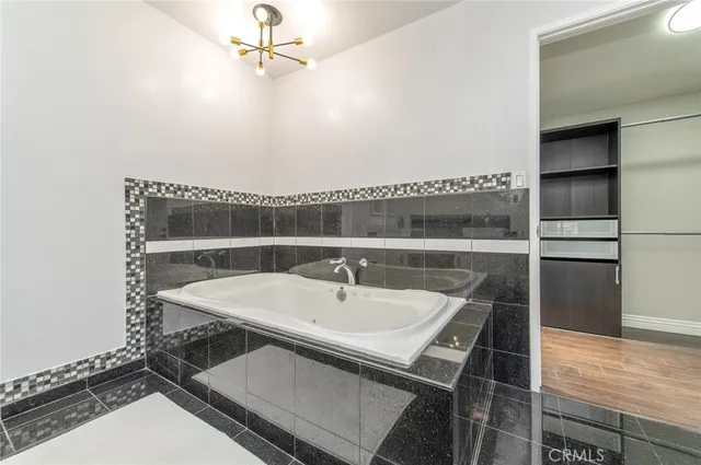 a view of swimming pool is middle in the garden