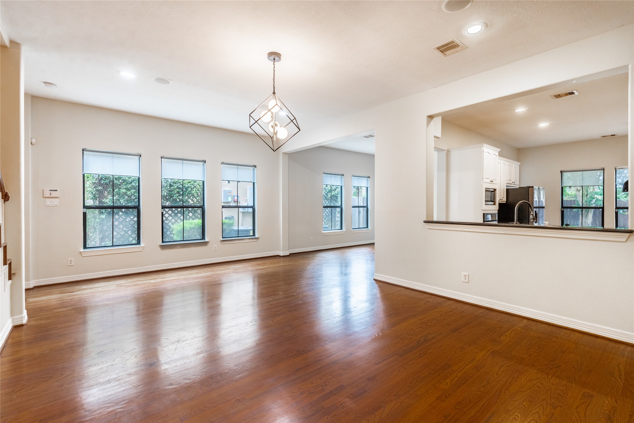 2923 Royal Oaks Crest Houston, TX 77082 - Photo 7 of 31 a view of an empty room with wooden floor and a window