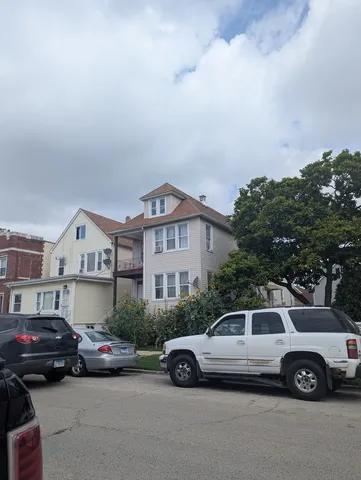 a front view of a house with parking space