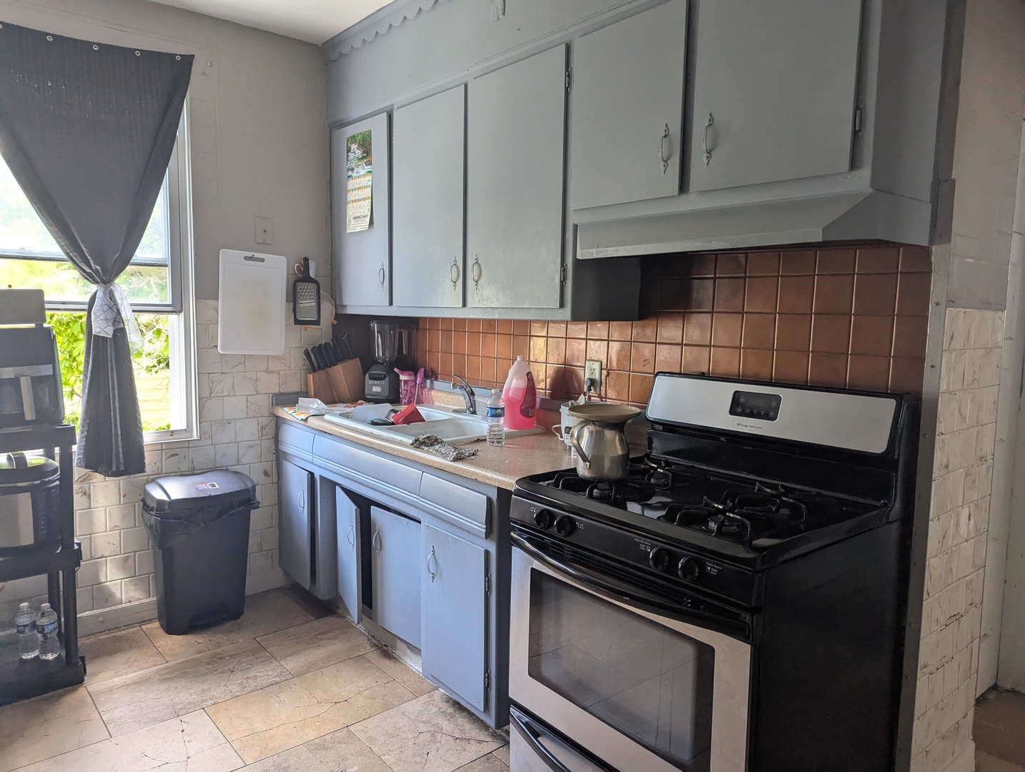 7548 West 61st Street Summit, IL 60501 - Photo 5 of 20 a kitchen with stainless steel appliances granite countertop a stove a sink and a white cabinets