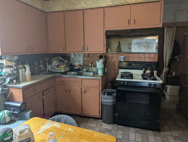 a kitchen with stainless steel appliances granite countertop a stove a sink and dishwasher