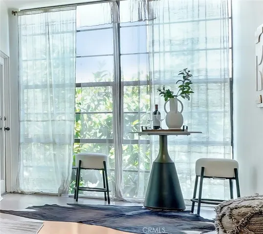 a view of a room that has a large window