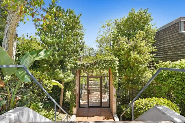 a view of a backyard with sitting area