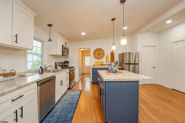 a large kitchen with lots of counter space and living room