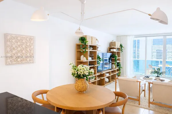 a dining room with furniture and window
