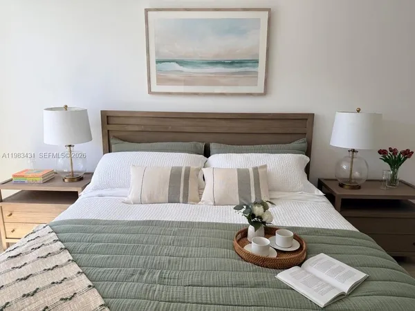 a bedroom with a bed and window