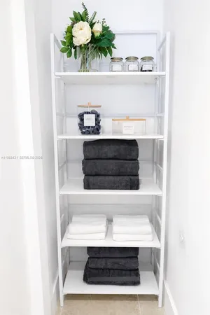 a view of kitchen with a potted plant on the counter