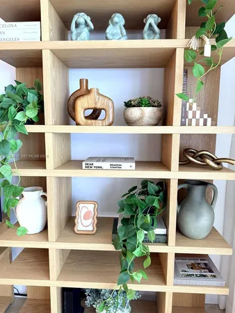 a room with lots of books and cabinets