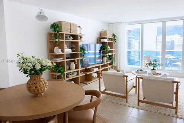 a dining room with furniture and wooden floor