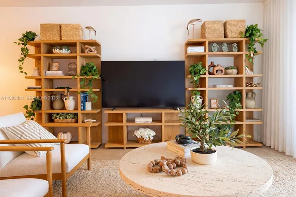 view of living room with furniture and flower pot