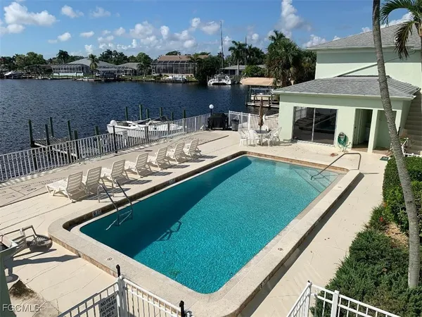 a view of a swimming pool with a lounge chairs