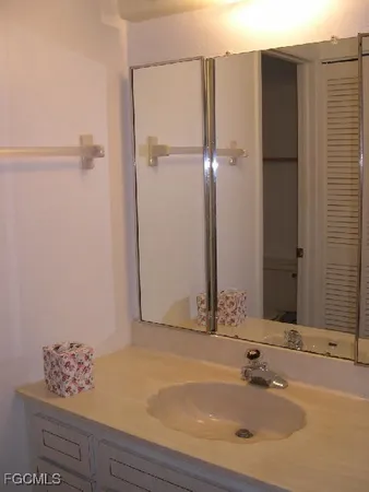 a bathroom with a tub and sink