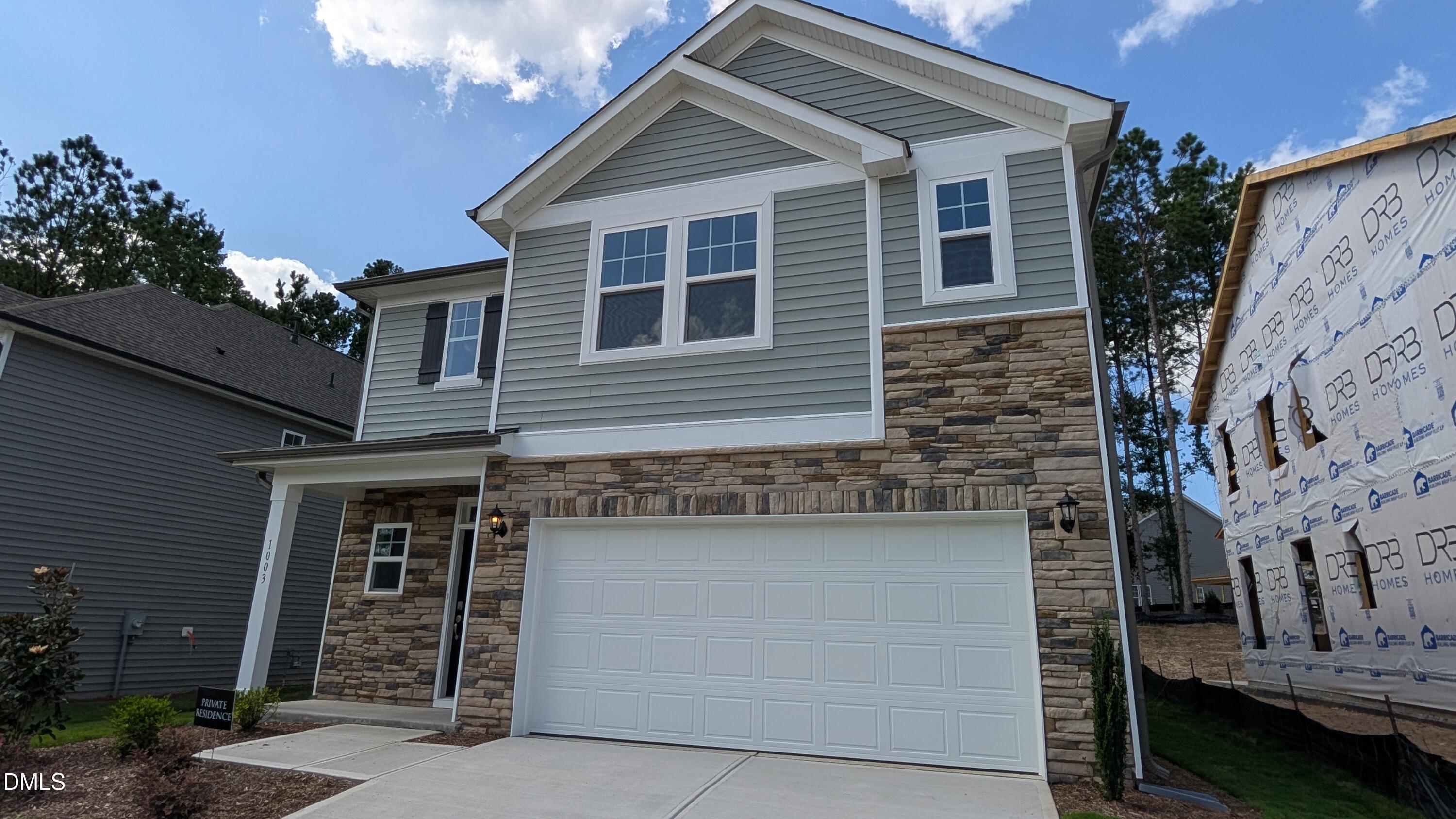 1003 Shovelhead Drive Durham, NC 27703 - Photo 1 of 21 a front view of a house with a yard