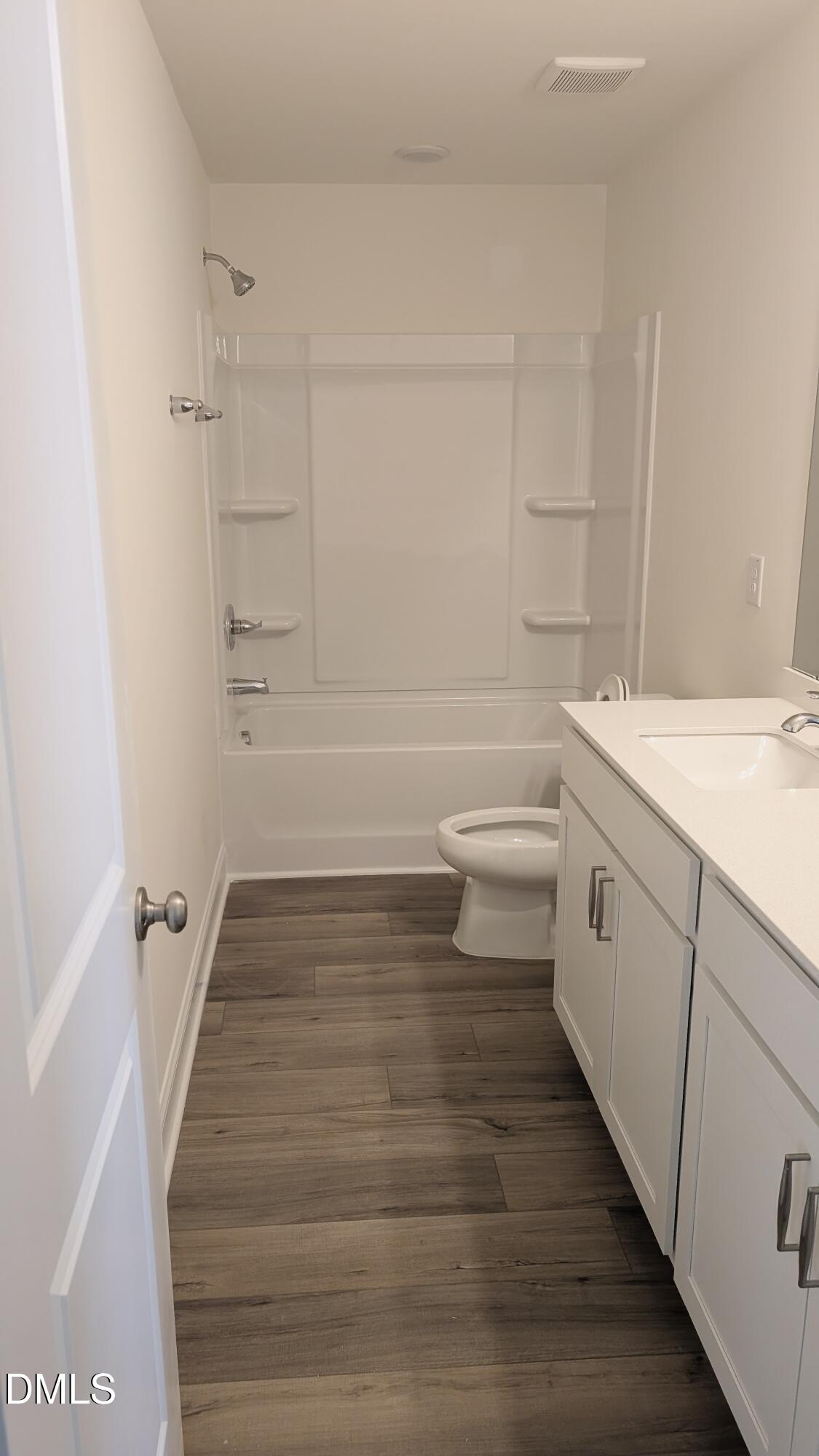 1003 Shovelhead Drive Durham, NC 27703 - Photo 11 of 21 a bathroom with a sink a toilet and shower