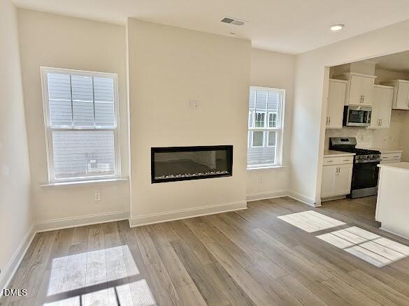1003 Shovelhead Drive Durham, NC 27703 - Photo 15 of 21 a view of flat screen tv and wooden floor in a room