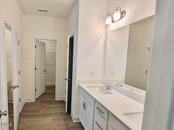 1003 Shovelhead Drive Durham, NC 27703 - Photo 16 of 21 a bathroom with a sink a mirror and a shower