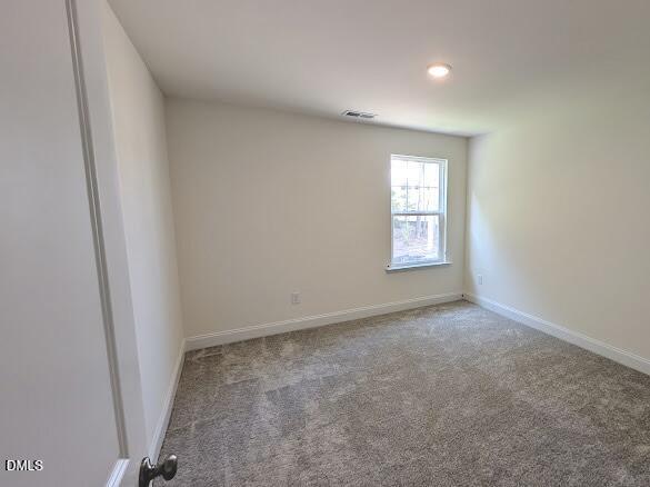 1003 Shovelhead Drive Durham, NC 27703 - Photo 18 of 21 an empty room with windows