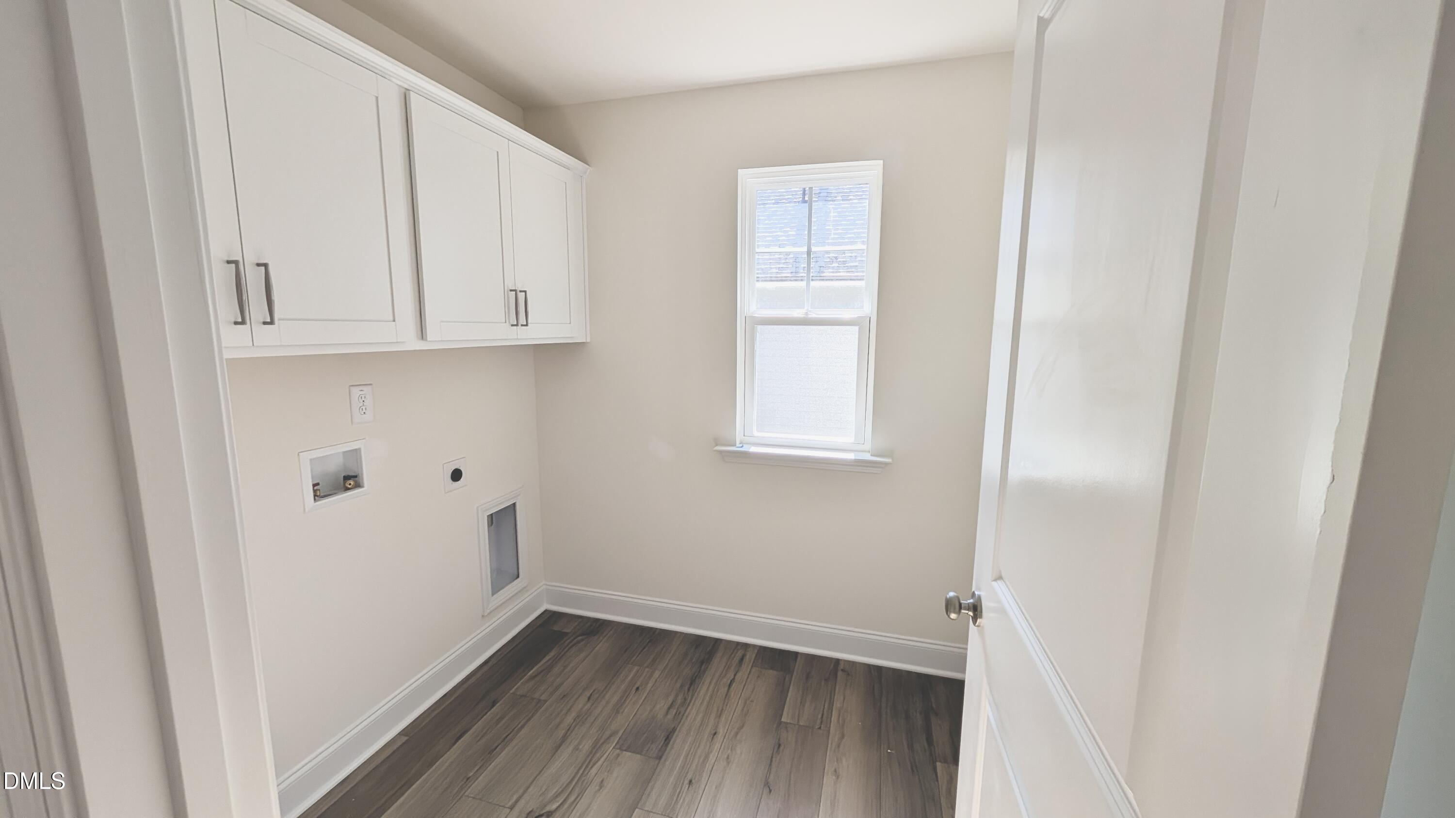 1003 Shovelhead Drive Durham, NC 27703 - Photo 8 of 21 a view of an empty room with wooden floor